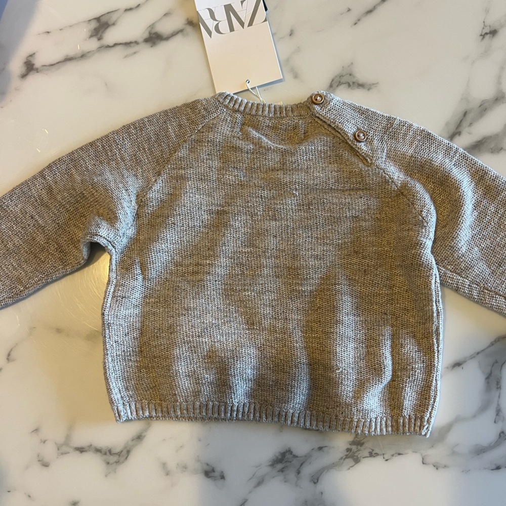 Knit sweater with button detail